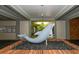 Welcoming foyer featuring a dolphin statue on a brick base with black pebbles at 4380 Exeter Dr # 204, Longboat Key, FL 34228