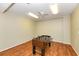Fun game room featuring a foosball table on a wood floor, offering leisure and enjoyment at 4380 Exeter Dr # 204, Longboat Key, FL 34228