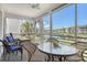 Relax on this screened lanai with comfortable seating, offering tranquil views of the bay and surroundings at 4380 Exeter Dr # 204, Longboat Key, FL 34228