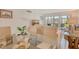 Bright living space seamlessly connected to a dining area, with ample natural light at 4380 Exeter Dr # 204, Longboat Key, FL 34228