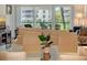 Inviting living room with views of the manicured grounds from the sliding glass doors at 4380 Exeter Dr # 204, Longboat Key, FL 34228