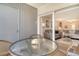 Cozy patio with wicker furniture and a glass table, perfect for enjoying the outdoors at 4380 Exeter Dr # 204, Longboat Key, FL 34228