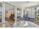 Relaxing outdoor patio with stylish seating, partial screening and serene water views at 4380 Exeter Dr # 204, Longboat Key, FL 34228