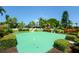 Community putting green with lush landscaping, perfect for enjoying leisure time outdoors at 4380 Exeter Dr # 204, Longboat Key, FL 34228