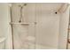 Contemporary tiled walk-in shower with glass door at 4380 Exeter Dr # 204, Longboat Key, FL 34228