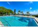 Large, well-maintained outdoor swimming pool with clear blue water and stunning waterfront views at 4380 Exeter Dr # 204, Longboat Key, FL 34228