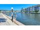 Picturesque canal view with boats docked, condo buildings, and a calming atmosphere at 4380 Exeter Dr # 204, Longboat Key, FL 34228