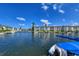 Stunning view of waterfront condos with serene waters, sailboats, and blue skies for peaceful living at 4380 Exeter Dr # 204, Longboat Key, FL 34228