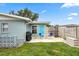 This backyard features seating, a grill, a well-maintained lawn and a basketball hoop for entertainment at 453 Sandlewood Dr, Venice, FL 34293