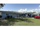 Charming single-story home with a well-manicured lawn and inviting front porch, plus an attached garage at 453 Sandlewood Dr, Venice, FL 34293