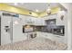 Bright kitchen with white cabinetry, granite countertops, tile backsplash, and stainless steel appliances at 453 Sandlewood Dr, Venice, FL 34293