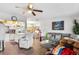 Bright living room boasts an open layout, stylish decor, and modern finishes with hardwood flooring at 453 Sandlewood Dr, Venice, FL 34293