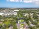 A high angle aerial view of a private home with an expansive yard in a serene, tree-lined neighborhood at 4805 Cypress Lake Ct, Sarasota, FL 34243