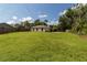 Expansive backyard with lush lawn and fencing providing privacy, perfect for outdoor activities and entertaining at 4805 Cypress Lake Ct, Sarasota, FL 34243