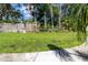 A beautifully landscaped backyard featuring a lush green lawn, perfect for relaxation and recreation at 4805 Cypress Lake Ct, Sarasota, FL 34243
