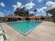 A beautiful large community pool on a bright sunny day for neighborhood residents at 4805 Cypress Lake Ct, Sarasota, FL 34243