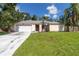 Inviting one-story home with a spacious driveway and well-maintained front yard, perfect for families at 4805 Cypress Lake Ct, Sarasota, FL 34243