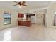 Open concept kitchen and dining area featuring tile flooring, breakfast bar, and stainless steel appliances at 4805 Cypress Lake Ct, Sarasota, FL 34243