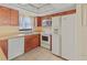 Kitchen with stainless steel appliances, light countertops, and plenty of storage at 4805 Cypress Lake Ct, Sarasota, FL 34243