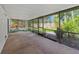 Large screened patio with views of the backyard, garden and pool, perfect for outdoor entertaining at 4805 Cypress Lake Ct, Sarasota, FL 34243