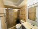 The bathroom features a glass enclosed shower and a modern vanity at 4805 Rilma Ave # 106, Sarasota, FL 34234