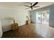 Spacious living area with tile flooring and access to the outdoor patio at 4805 Rilma Ave # 106, Sarasota, FL 34234