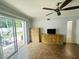 Bright living area featuring neutral paint and sliding glass doors to the patio at 4805 Rilma Ave # 106, Sarasota, FL 34234