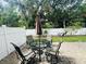 Paver patio with an outdoor dining set, perfect for enjoying the backyard at 4805 Rilma Ave # 106, Sarasota, FL 34234
