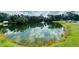 A tranquil pond with a fountain adds to the appeal of the Summer Lakes community at 4805 Rilma Ave # 106, Sarasota, FL 34234