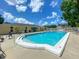 Community pool with inviting seating areas and clear blue water for resident enjoyment at 4805 Rilma Ave # 106, Sarasota, FL 34234
