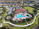 Aerial view of community with pool, clubhouse, and green spaces at 4916 Tivoli Run, Bradenton, FL 34211