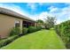 Private backyard with lush landscaping, offering a serene and tranquil retreat for outdoor relaxation and enjoyment at 4916 Tivoli Run, Bradenton, FL 34211