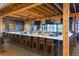 Well-appointed bar area with a long counter, comfortable seating, and stylish lighting at 4916 Tivoli Run, Bradenton, FL 34211