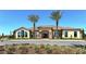 Beautiful building exterior framed by palm trees and showcasing lovely landscaping at 4916 Tivoli Run, Bradenton, FL 34211