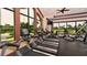 Spacious gym featuring treadmills, ellipticals, and large windows offering scenic views at 4916 Tivoli Run, Bradenton, FL 34211