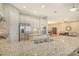 Bright kitchen featuring granite countertops and stainless steel appliances, open to the dining area at 4916 Tivoli Run, Bradenton, FL 34211