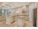 Spacious kitchen boasts stainless steel appliances, granite countertops, and custom cabinets at 4916 Tivoli Run, Bradenton, FL 34211