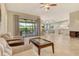 Open concept living room with access to the outdoor patio and backyard at 4916 Tivoli Run, Bradenton, FL 34211