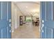 View from front door showing spacious open floor plan with living room, dining area, and sliding glass doors at 4916 Tivoli Run, Bradenton, FL 34211