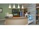 Lobby area with a juice bar and decorative lighting at 4916 Tivoli Run, Bradenton, FL 34211