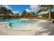 Inviting community pool with palm trees and Bahia Bar at 4916 Tivoli Run, Bradenton, FL 34211