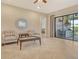 Open sitting room with sliding doors to backyard area featuring outdoor kitchen and furniture at 4916 Tivoli Run, Bradenton, FL 34211