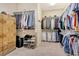 Spacious walk-in closet with custom shelves, rods, drawers, and ample storage for shoes and accessories at 4916 Tivoli Run, Bradenton, FL 34211