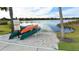 Waterfront canoe and kayak launch with no swimming allowed sign and waterfront homes in the background at 4916 Tivoli Run, Bradenton, FL 34211