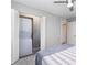 Bedroom closet featuring an in-unit stacked washer and dryer at 522 Pine Ave # 8B, Anna Maria, FL 34216