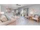Bright living room featuring neutral decor, a ceiling fan, tile flooring, and sliding glass doors to a patio at 522 Pine Ave # 8B, Anna Maria, FL 34216