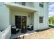 Outdoor patio with a seating area perfect for relaxing and enjoying the outdoors at 522 Pine Ave # 8B, Anna Maria, FL 34216