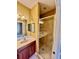 Tiled shower and double sink vanity are the focal points in this bathroom at 5620 Whitehead St, Bradenton, FL 34203