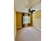 Bedroom featuring carpet, ceiling fan and a window with shutters at 5620 Whitehead St, Bradenton, FL 34203