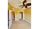 Cozy bedroom with ceiling fan and carpeted floor at 5620 Whitehead St, Bradenton, FL 34203
